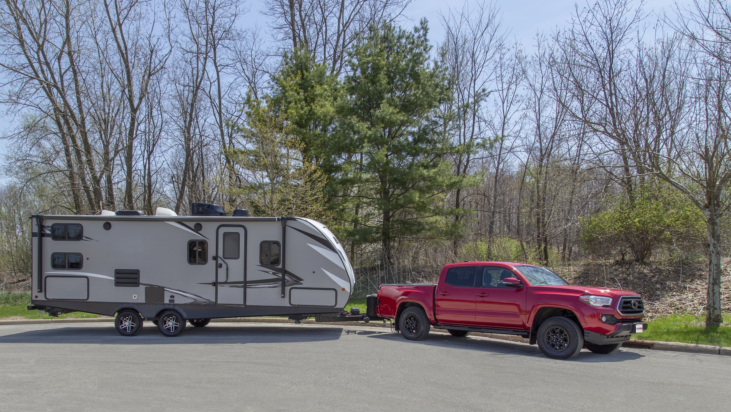 Red Truck Towing RV Camper