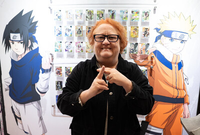 Maile Flanagan, voice of Naruto Uzumaki, strikes a jutsu pose to celebrate the U.S. launch of officially licensed Kayou NARUTO cards. New York Comic Con attendees got to meet the vocal legend and receive an autographed NARUTO Kayou card.