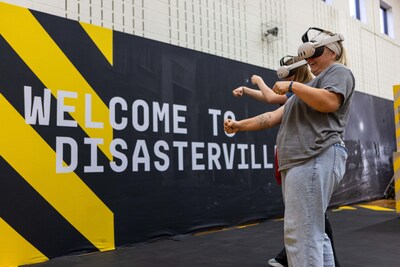 Disasterville, a new mixed-reality experience from the Army National Guard, features advanced hand-tracking technology, eliminating the need for game controllers and allowing students to interact with others and physically use in-game props.
