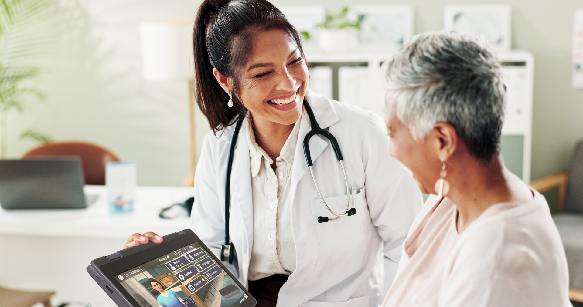 Doctor and Senior using Addison Tablet