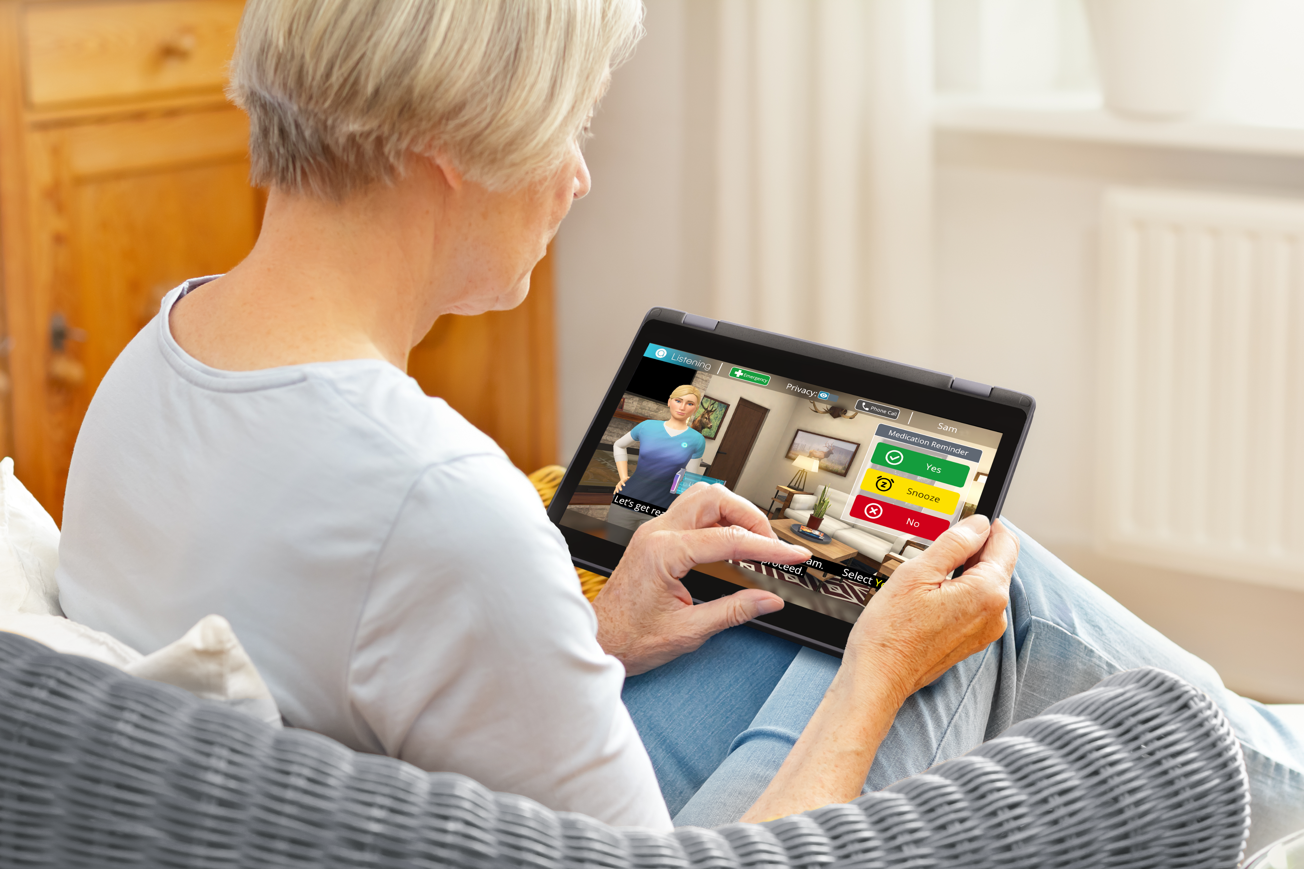 Senior Woman using Addison Tablet from over shoulder